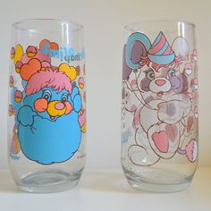 two glasses with cartoon characters painted on them