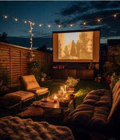 an outdoor movie is set up in the backyard