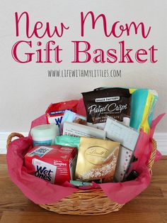 a basket filled with lots of goodies on top of a wooden table next to a white wall