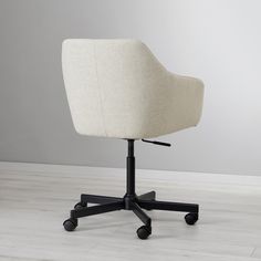 an office chair with wheels on the floor