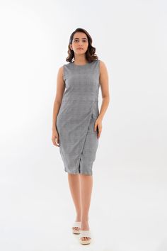 Our sleeveless overlap shift dress features a chic and sophisticated overlap design that flatters all body types. Crafted with high-quality, comfortable fabric, this dress is perfect for any occasion, whether you dress it up for a formal event or for a day out. With its versatile style and range of sizes, this dress is a must-have addition to your wardrobe. The sleeveless design allows for a relaxed feel, while the overlap detail adds a touch of elegance to the overall design. Sleeveless Asymmetrical Dress For Workwear In Spring, Summer Office Wear Knee-length Midi Dress, Asymmetrical Sleeveless Dress For Spring Workwear, Sleeveless Midi Dress For Office, Sleeveless Formal Wrap Dress, Fitted Asymmetrical Sleeveless Dress For Work, Chic Knee-length Wrap Dress For Office, Chic Sleeveless Formal Wrap Dress, Sleeveless Wrap Dress For Spring Workwear