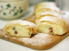 some type of pastry sitting on a cutting board