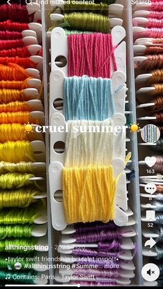 several rows of different colored spools of thread