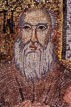 a close up of a mosaic with a man's face