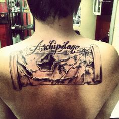 the back of a man's neck with an inked message on it that reads, acuplage