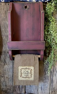 an old wooden chair with a towel hanging from it's back