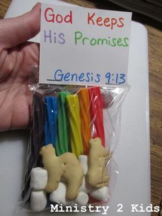 a hand holding a bag of candy with some bears on it and a sign that says god keeps his promises