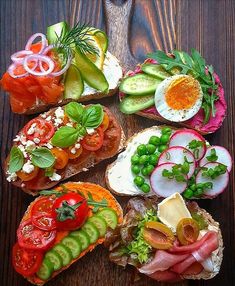 several different types of food are arranged on bread