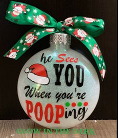 a christmas ornament that says he sees you when you're pooping