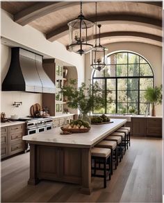 a large kitchen with an island and lots of counter space