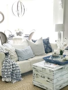 a living room filled with furniture and pillows