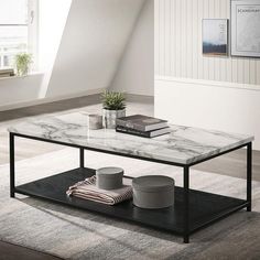 a marble coffee table sitting on top of a rug