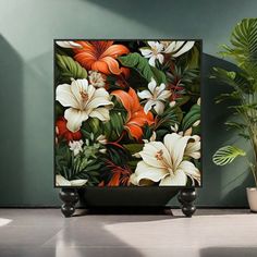 an image of a plant with flowers on the screen in front of it and another plant next to it