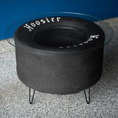 a black pot sitting on top of a glass table