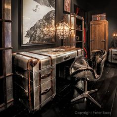 an old fashioned desk and chair in a room