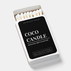 an open box of coco candle matches on a white background