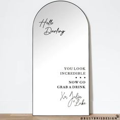 a mirror with the words hello daddy written in cursive writing on it and an oval frame