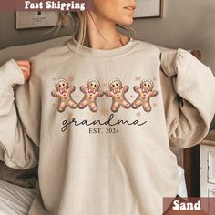 Are you looking for  grandma gingerbread christmas sweatshirt? We got you! ✅ ABOUT OUR Personalized Nana Crewneck Gift ▸  These garments are made from polyester and cotton.  ▸ The collar is ribbed knit, so it retains its shape even after washing.  ▸ There are no itchy side seams on these sweaters. ▸Printed and shipped from the USA ▸ Shipped in a safe package to ensure it arrives perfect. GUARANTEED. ✅ HOW TO ORDER your Nana Custom Sweater 1. Check our photos for sizing and color options. 📏 2. C Nana Sweatshirt, Grandma Sweatshirt, Custom Sweaters, Gingerbread Christmas, Gift For Grandma, Sweater Gift, Grandma Gifts, Christmas Sweatshirts, San Jose