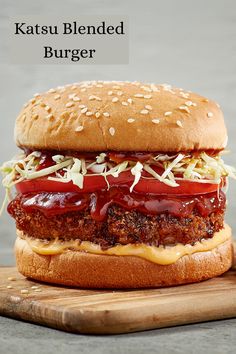 a hamburger with meat, cheese and ketchup on it