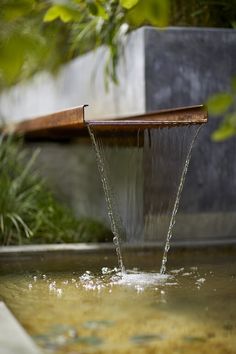 a water fountain spewing out from it's side