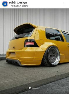 a yellow car parked in front of a building