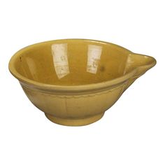 a large yellow bowl with two handles on the top and bottom, sitting in front of a white background