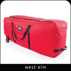 a red duffel bag sitting on top of a white floor next to a black handle