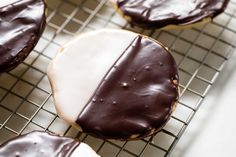 chocolate covered donuts cooling on a wire rack