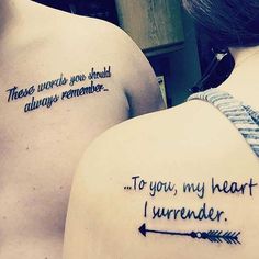 two people with tattoos that say to you, my heart and i'm under