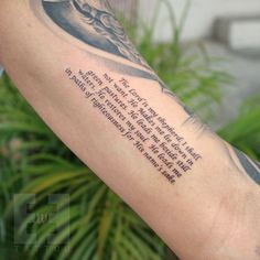 a person with a tattoo on their arm has a poem written in the upper corner