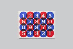 the numbers are arranged in red, white and blue circles on a gray background with black dots