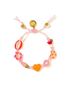 a pink bracelet with charms and fruit on the front, including an orange heart in the middle