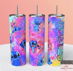 three matching tumbles with cartoon characters on them, one is pink and the other is blue