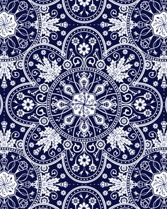 an ornate blue and white pattern with flowers, leaves and swirls on a dark background