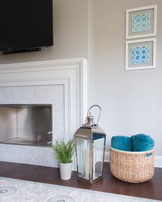 a living room with a fire place and a basket on the floor