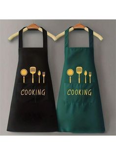 two aprons that say cooking and cooking with utensils on the front one