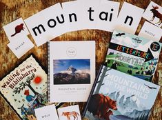 there are many books on the table with each one's name and pictures around it