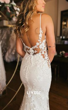 a woman in a wedding dress looking back