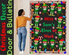 a woman standing in front of a christmas themed door mat with the words miss sam's elves at work on it