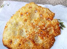 two fried food items sitting on top of a white cloth