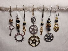 there are many different types of earrings hanging from hooks