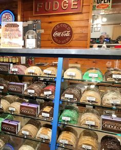 a display case filled with lots of different types of bread