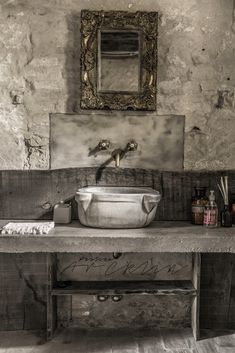 an old fashioned sink in a rustic bathroom