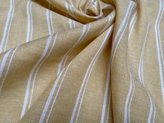 a close up view of a tan and white striped fabric