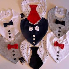 six bibs with different colors and designs on them