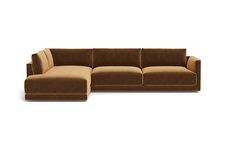 a brown couch sitting on top of a white floor