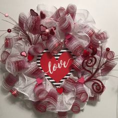 a valentine's day wreath with the word love on it