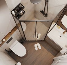 an aerial view of a bathroom with toilet, sink and shower