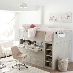 a loft bed with desk and drawers underneath it