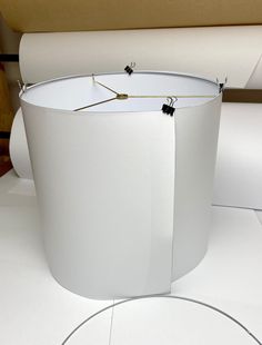 a white round object with black tags on it's sides sitting on top of a table